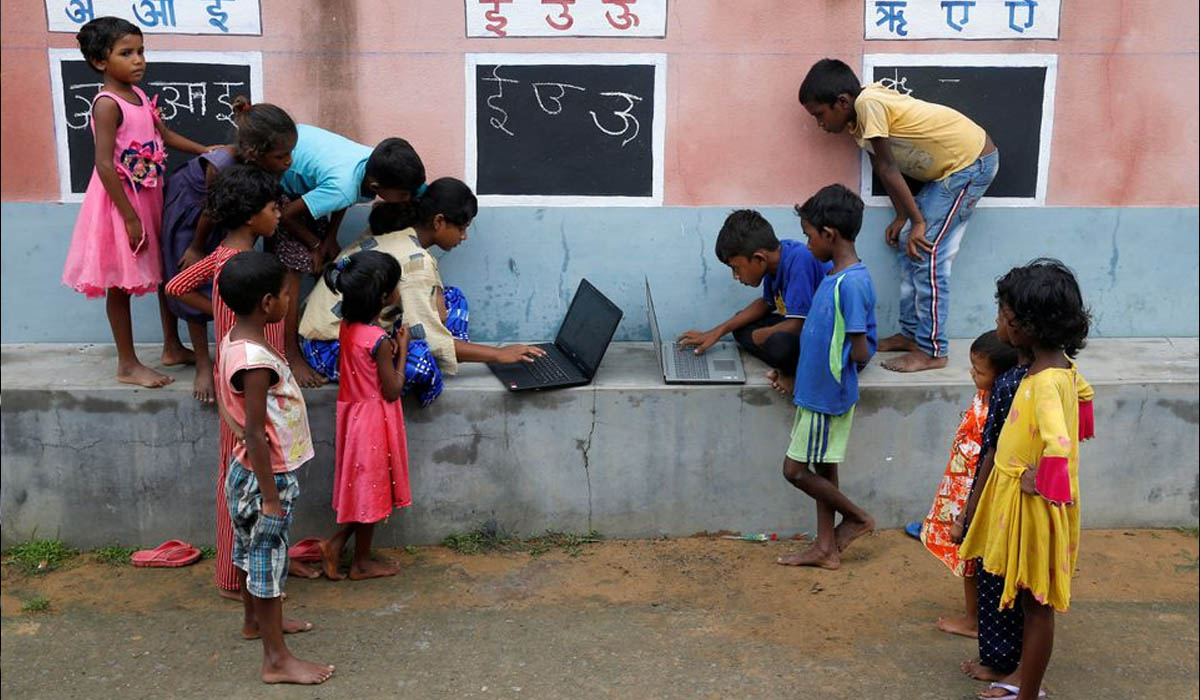 In remote Indian village teacher turns walls into blackboards to close school gap